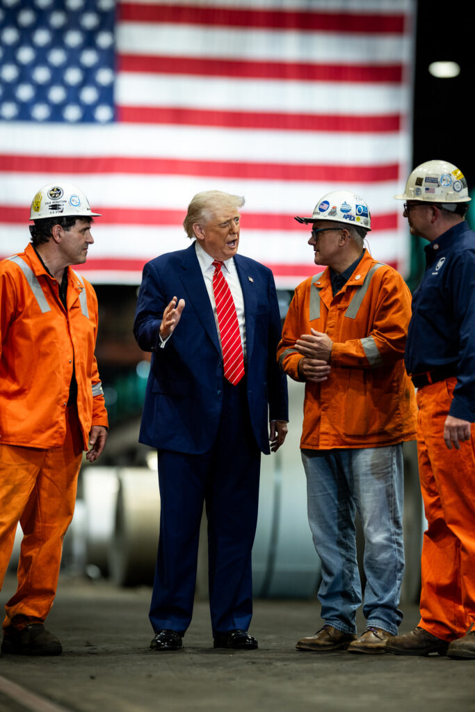 president Donald J Trump speaking with workers